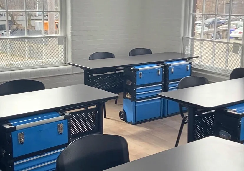 Interior photo of the RI Tattoo Academy's clean, brightly lit classroom